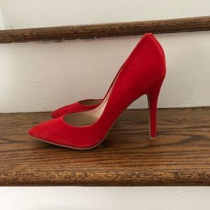 Red suede pumps